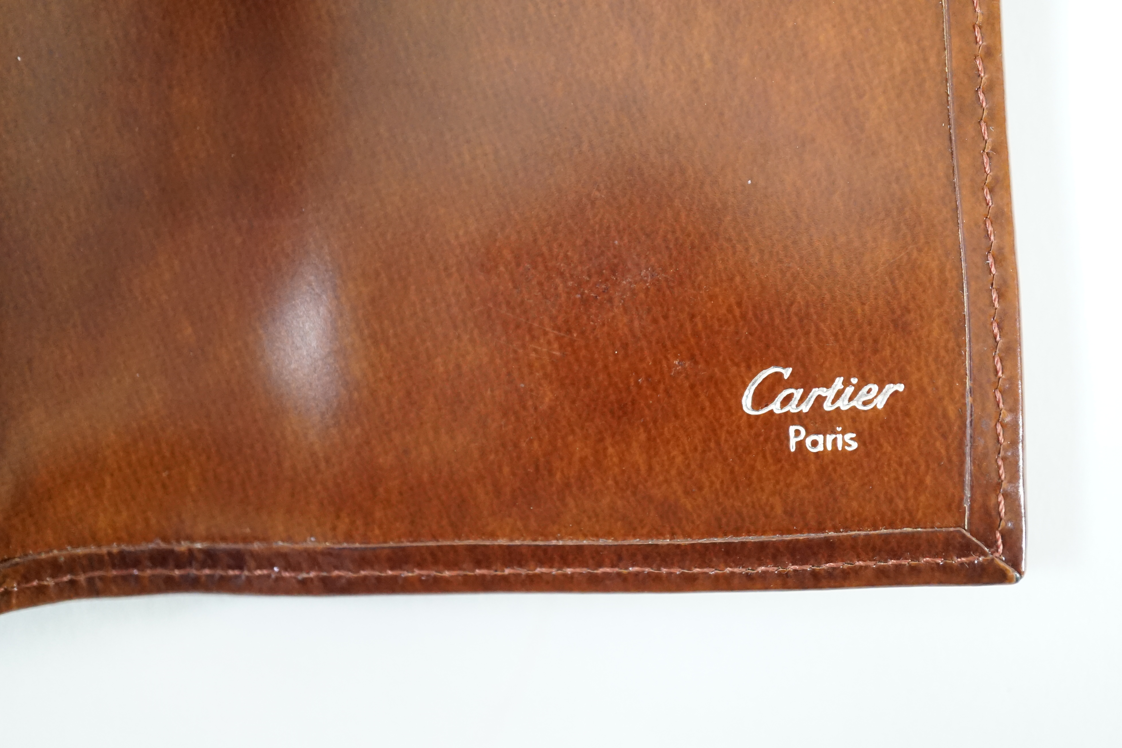 A vintage Cartier Panthere brown leather wallet, height 11cm, width 14.5cm, depth 2cm